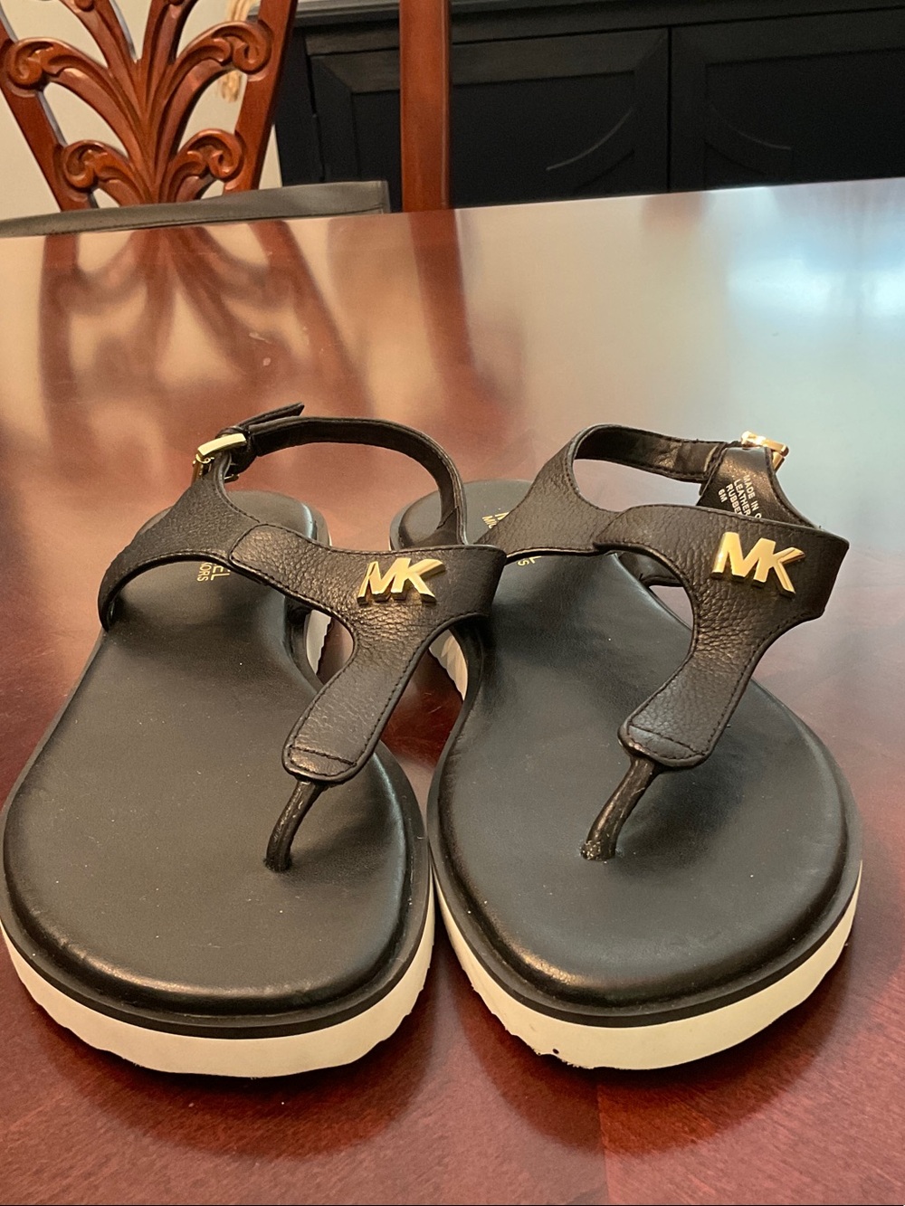 Michael Kors Black Thong Sandals with Gold MK Hardware